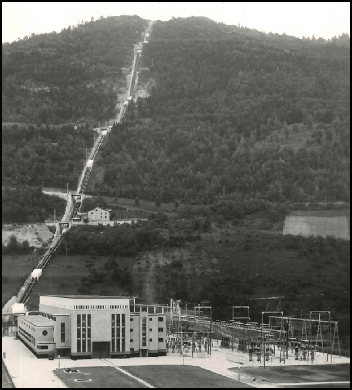 Historic photograph of the Chandoline plant and its penstock
