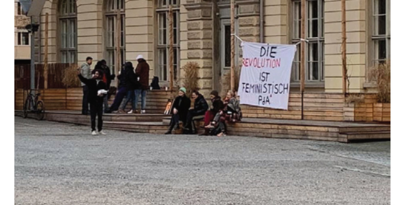 Political banner in front of the school building